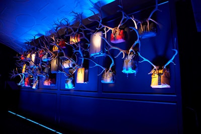Other taxidermy pieces were removed from the trophy room to accommodate a wall of Tumi bags sprouting antlers.