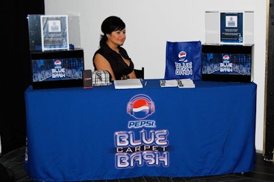 Staff at the Pepsi Blue Carpet Bash distributed promotional material.