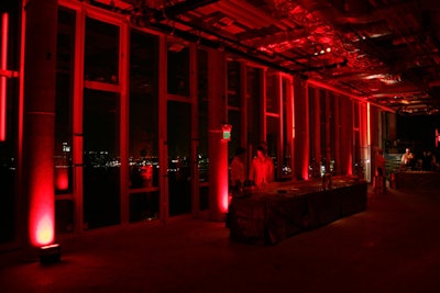 With generators and battery-powered pieces, Levy Lighting illuminated both floors with bright red lights. Fluorescent strips surrounded the penthouse space, and the event's ruby glow was visible from the street.