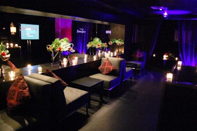 At the Luxury Lounge in Lobby, the all-black downstairs space included sticker logos of the featured brands and purple lighting.