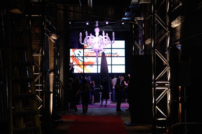 An oversize white chandelier hung in the centre of the party tent, which also featured a panel of LG televisions.