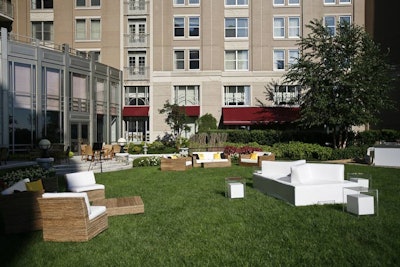 Room Service furniture rental provided stark white couches, translucent tables, and rattan canopied day beds to dress up the Mandarin Oriental's manicured garden.