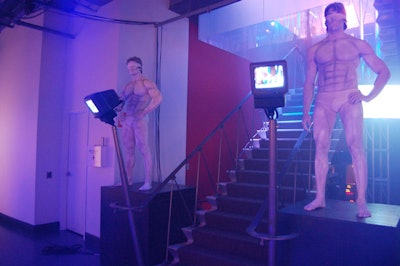 Two models wearing silver underwear, body paint, and blindfolds stood at the foot of the staircase leading to the after-party for the film Blindness at CTV's Queen Street headquarters.