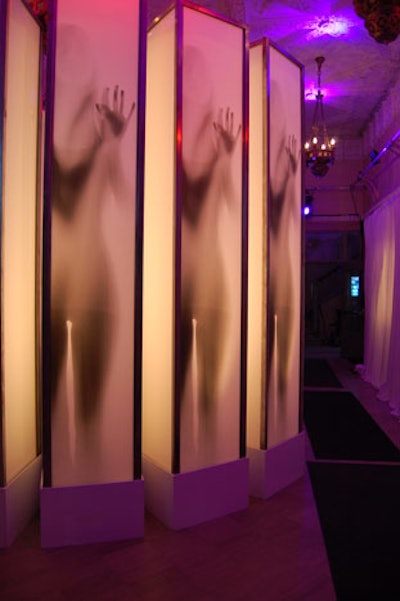 The entrance to the Blindness after-party featured tall white columns that appeared to have people trapped inside.