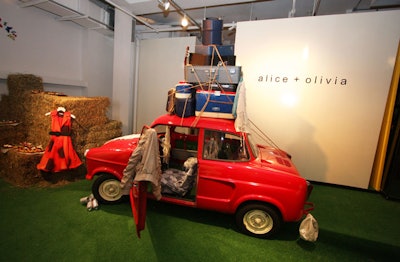 Other accents for the Alice & Olivia show ranged in scale from a red car with suitcases stacked on top to a partly painted mural surrounded by open paint cans, tambourines, patchwork quilts, and a hookah.