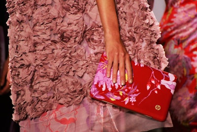 Vivienne Tam used her spring/summer 2009 presentation to debut her new partnership with Hewlett-Packard. The fashion designer and technology company teamed up to create a digital clutch—a special-edition notebook featuring a red peony cover—which matched five pieces in the collection.