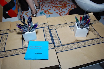 Notepads from the office supplies company covered the surface of the tables, allowing visitors to leave their mark in the OfficeMax lounge.
