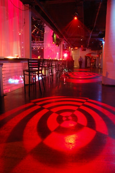 Red lighting abounded at the party, often in the shape of bull's-eye gobos projected onto the floors.