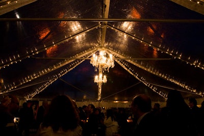 A clear tent decorated with mini lights and chandeliers provided a second party area beside the ship.