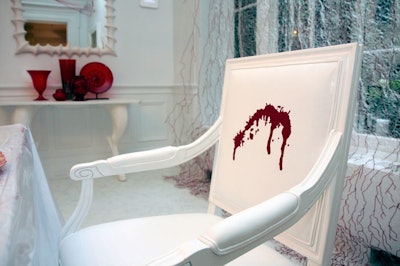 Leah Pickler embroidered red silk into splotches and droplets of blood on the 12 chairs in the Dexter dining room.
