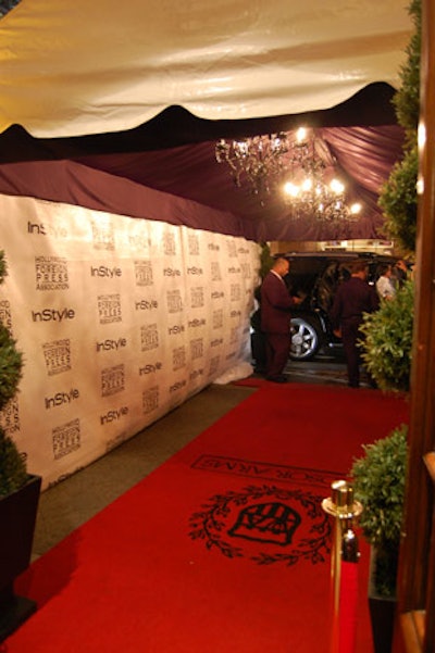 Three chandeliers hung in the tent over the red carpet at the entrance to the Windsor Arms Hotel.