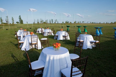 The cocktail reception spilled out onto the lawn outside of the tent.