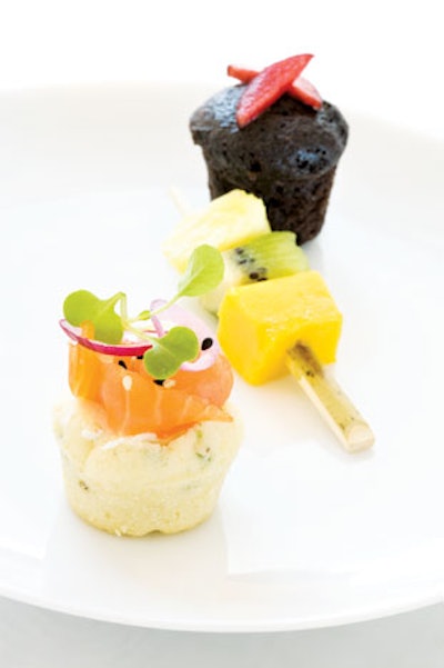 Mini dark-chocolate and cherry muffin; charred pineapple, mango, and kiwi skewer; and chive scone with maple-smoked salmon, mascarpone, and watercress, from Lindsey Shaw Catering in Toronto
