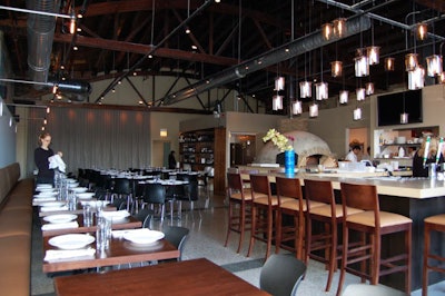 The sleek, contemporary dining room seats 65 guests at banquettes and four-top tables.