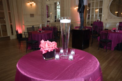 Hot pink floral arrangements adorned the reception's tables and entryway.
