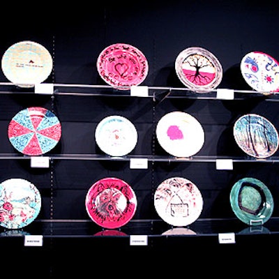 The Retreat displayed 142 plates painted by artists and other celebrities to be auctioned for the organization.