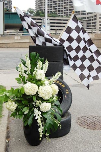 Piles of tires, checkered flags, and floral arrangements from San Remo Florist marked the starting line for the scavenger hunt.