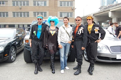 Singer Matt Dusk (centre) joined his team for photos in the parking lot at Harbour Sixty Steakhouse.