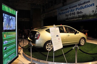 A Toyota Prius from a local dealership sat on a rotating platform at the party entrance.