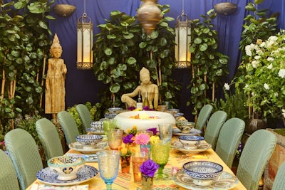 Fine and Faucet's designers strung tall and round bronze-hued lanterns over their table, casting a tranquil glow that was in keeping with the Zen-like look of the design, which included a number of Buddha statues.