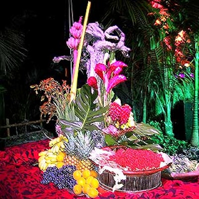 Lush arrangements of bananas, pineapples, ginger flowers, dendrobium orchids, philodendron leaves and grapes decorated the food stations.