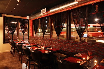 A colour scheme of black and red carries through the space.