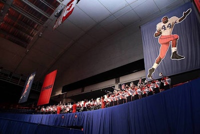 The Syracuse University marching band played the fight song for the football-friendly crowd.