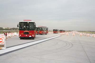 Trolleys transported guests from a designated airport parking lot to the entrance of the tent.