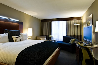 The guest rooms at the Liaison Capitol Hill, part of the Affinia brand of hotels, feature 37-inch TVs, chaise lounges, and contemporary light fixtures.
