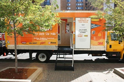 The orange exterior of the tour truck included the Save The Walls slogan and 3M retailer logos.