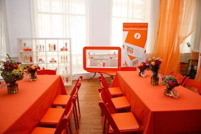 For the luncheon, Lippe Taylor used orange linens, chairs, and drapes to match the colors of the previously launched Yes to Carrots product line.