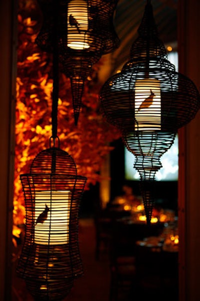 Groupings of birdcage lanterns woven from buri—a product of fibrous palm trees—had bird silhouettes stenciled on their illuminated centers.