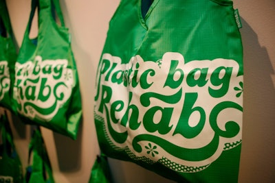 The store encourages the use of reusable shopping bags like those on display.