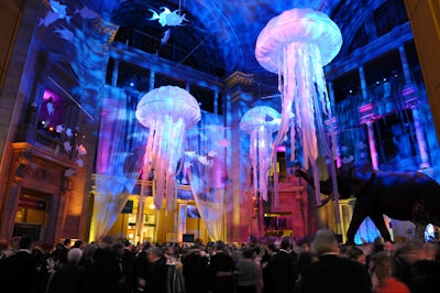 Giant jellyfish and tropical fish mobiles dangled overhead in the museum's rotunda, while blue lights gave the space a dreamy, underwater feel.