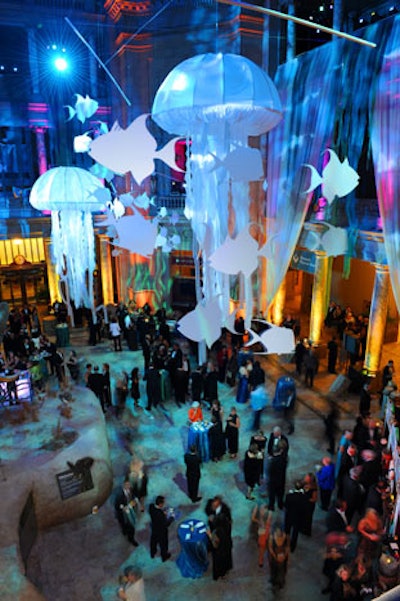 Guests gathered in the Museum of Natural History's rotunda to listen to remarks from museum director Dr. Cristián Samper and major donor Roger Sant, followed by a short show in which giant fabric jellyfish floated on wires across the rotunda.