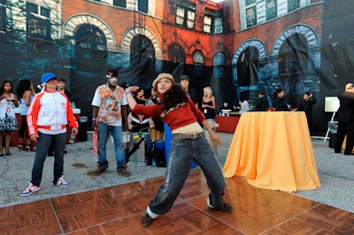 Breakdancers and backdrops featuring New York City apartments acknowledged Haring's roots as a street artist in the city.