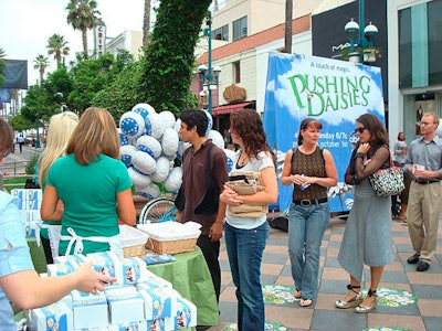 Staff handed out branded takeout boxes with the show's time slot and premiere date for visitors who wanted pie to go.