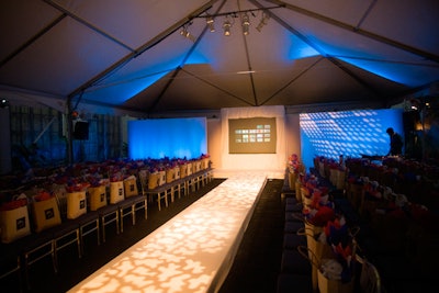 A tent in the St. Regis hotel's courtyard featured a fabric-wrapped runway decorated with light projections.