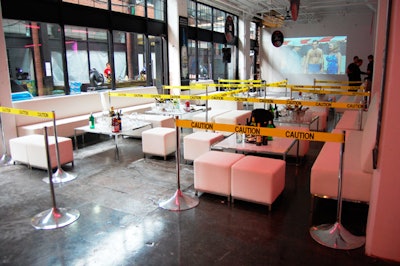 Organizers projected old James Bond films onto the wall and used yellow caution tape to separate V.I.P. seating areas in the main event space.