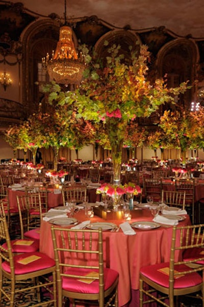 At the dinner tables, custom-made bronze light boxes illuminated six-foot-tall crystal vases filled with Japanese maple branches.