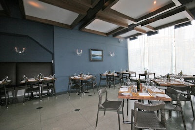 The main dining room, outfitted with terrazzo floors and ceiling-mounted light boxes, seats 77.