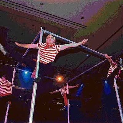 An acrobatic troupe dressed as gondoliers performed on a rotating cage.