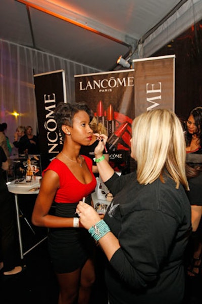 At the cocktail reception that preceded the fashion show, guests had their makeup touched up by Lancome artists.