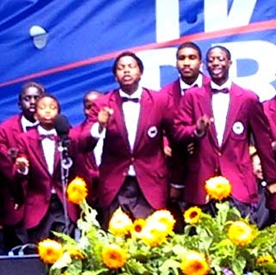 The Boys Choir of Harlem sang and danced in honor of Clinton's arrival.