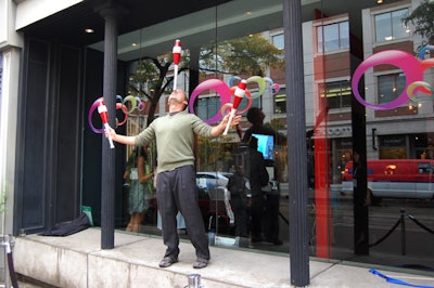 A juggler and contortionist from Zero Gravity Circus performed on the street outside Kultura.