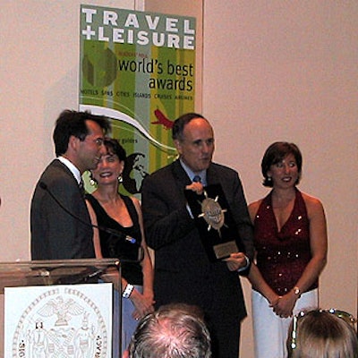 Mayor Rudolph Giuliani accepted 'Best City in North America' award from (left) M.C. Dave Price from Fox 5's Good Day New York, T&L editor Nancy Novogrod and publisher Ellen Asmodeo-Giglio.