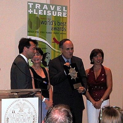Mayor Rudolph Giuliani accepted 'Best City in North America' award from (left) M.C. Dave Price from Fox 5's Good Day New York, T&L editor Nancy Novogrod and publisher Ellen Asmodeo-Giglio.