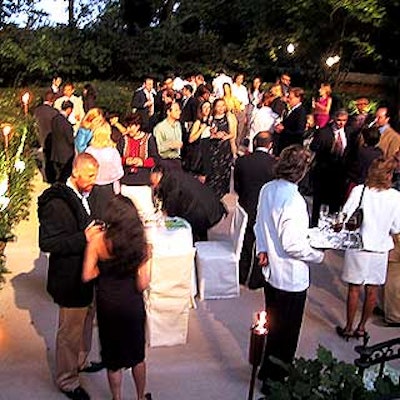After the ceremony, guests mingled in a reception in the mansion's suburban-like back yard.