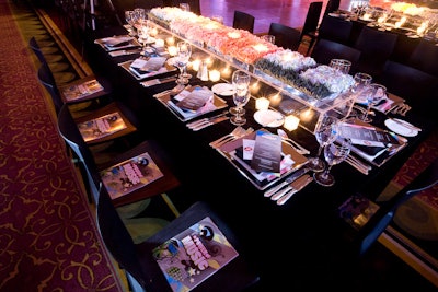 Tables draped in black linens featured a graffiti-inspired menu, a glow stick at each place setting, and Aldo cuff bracelets, which were sold to help fund YouthAIDS.