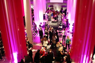 Hot pink fabric hung from the ceiling of the River East Art Center, where a Nordstrom shoe boutique took over the center of the space.